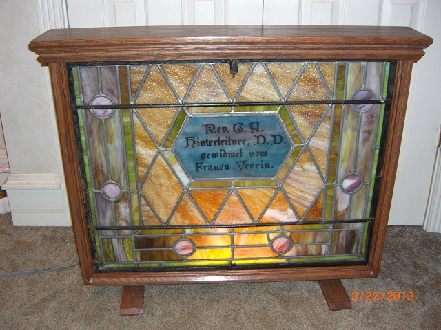 This is a display cabinet for an old church stained glass window 